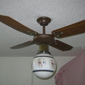 36" brown/brass SMC "laguna" ceiling fan in my bedroom at my current home