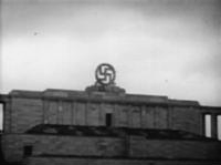 Swastika_blasted_from_the_Nazi_party_rally_grounds_-_Nuremberg_%281945%29.gif