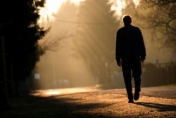 man-walking-alone-into-sunset.jpg