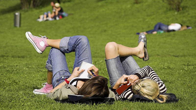 two girls lying on grass.jpg
