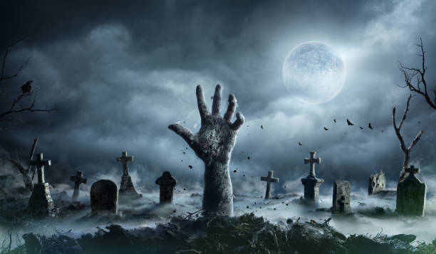 zombie-hand-rising-out-of-a-graveyard-in-spooky-night.jpg