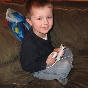 Adam playing his Wii.... probably Star Wars Legos.
