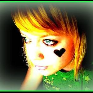 In '07 when I had short, blonde hair, and liked to draw hearts on my cheek in eyeliner lol. I edited it though, just brightened it up a lot.