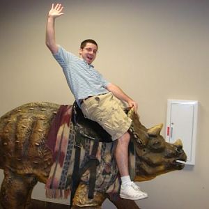 Riding a dinosaur at the creation museum in Kentucky.