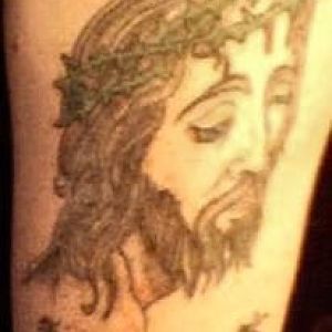 Face of Jesus on upper left arm