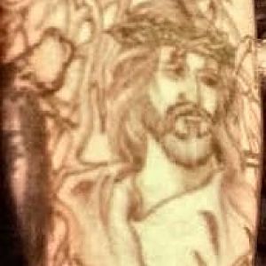 Jesus, on inner lower right arm