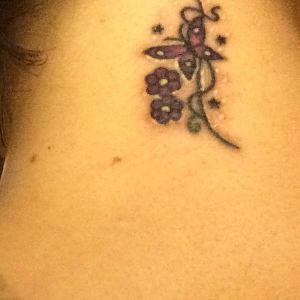 Butterfly neck tattoo