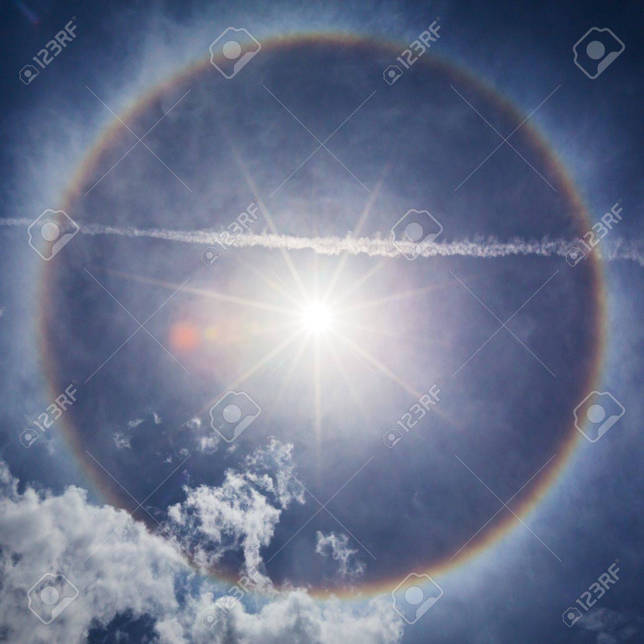 21823820-sun-with-circular-rainbow-sun-halo-occurring-due-to-ice-crystals-in-atmosphere