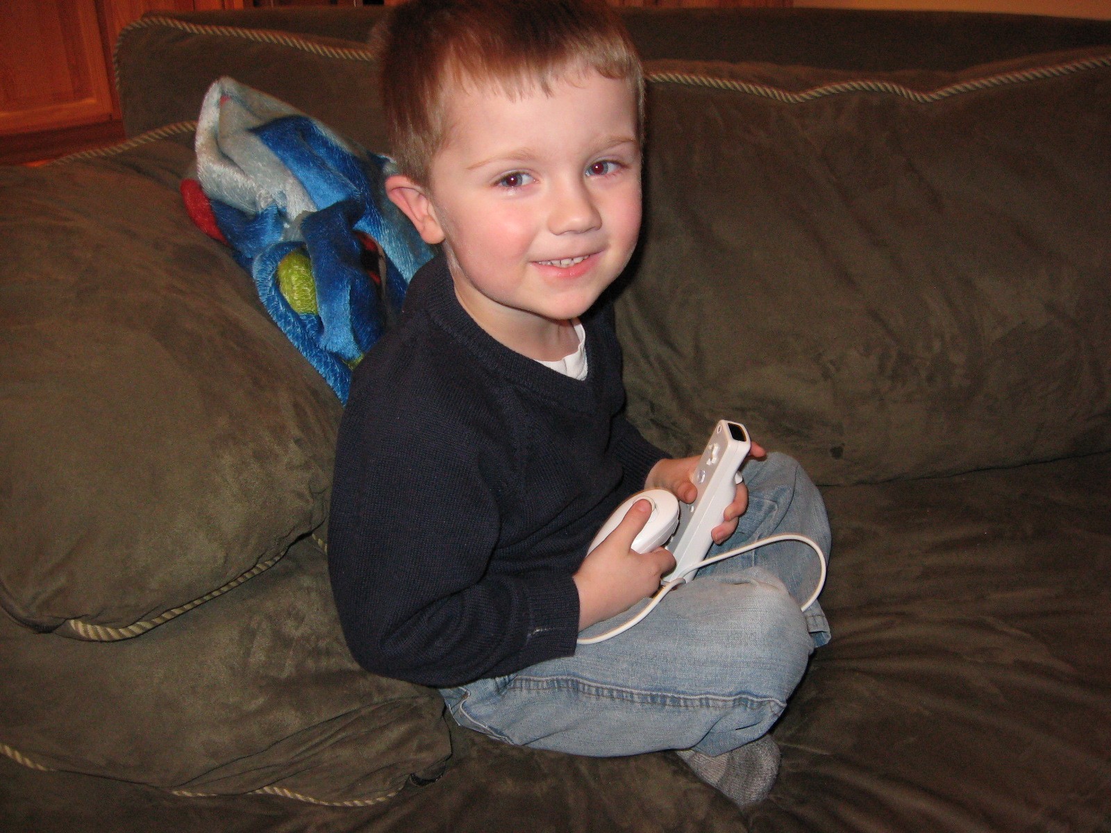 Adam playing his Wii.... probably Star Wars Legos.