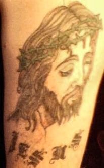 Face of Jesus on upper left arm
