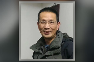 Pastor John Cao appears very happy.