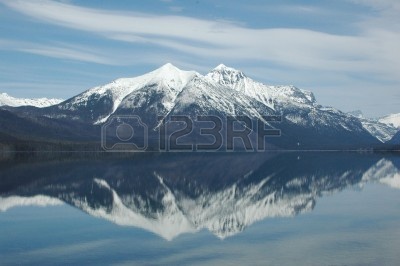 5954078-a-mountain-is-reflected-in-the-calm-still-waters-of-a-lake.jpg
