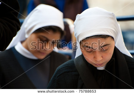 stock-photo-jerusalem-april-palestinian-catholic-nuns-pray-outside-of-the-church-of-the-holy-sepulcher-in-75788653.jpg