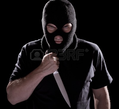 10834662-burglar-in-mask-holding-knife-on-black-background.jpg
