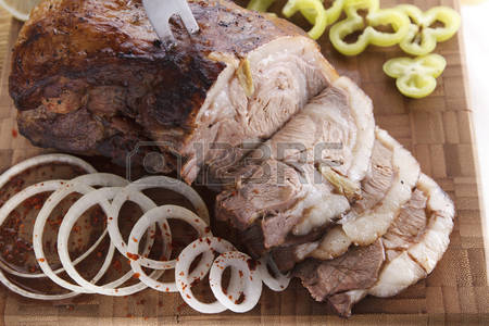 48516370-sliced-lamb-loin-roast-on-a-wooden-plate.jpg