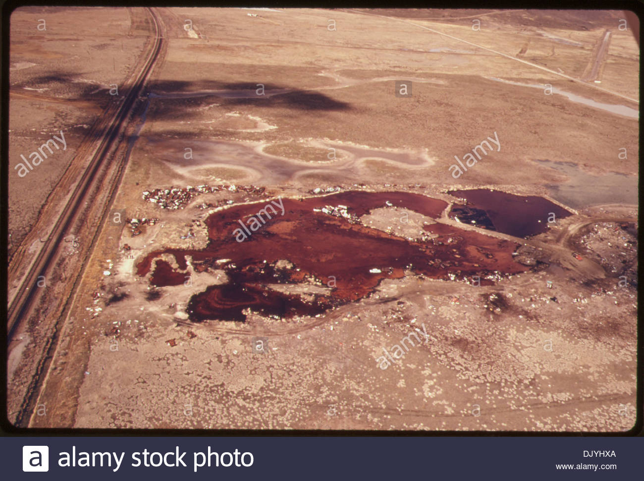 aerial-view-of-a-five-acre-pond-that-contained-acid-water-oil-acid-DJYHXA.jpg