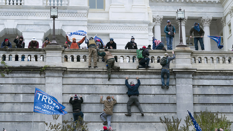 11428639_010522-cc-ap-capitol-riot-climbing-file-img.jpeg