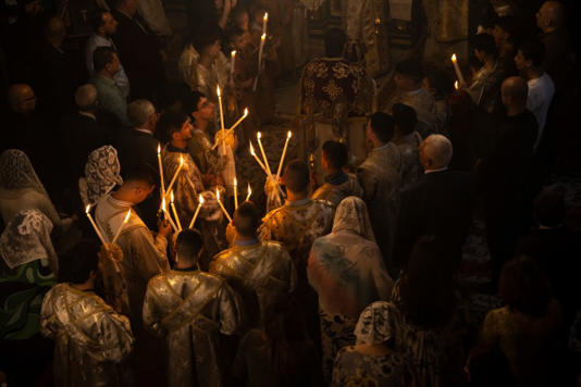 Palestinian Christians attend Palm Sunday mass in a Greek Orthodox church in Gaza City, on Sunday, April 9, 2023 [Fatima Shbair/AP Photo]