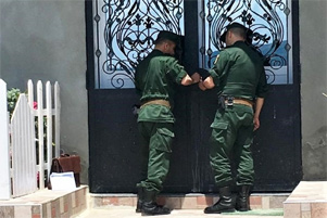Officials sealing a church's door.