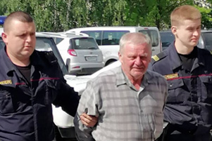 Vladimir Burshtyn being taken to court.