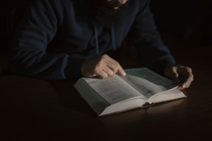 A man reading the Bible (Unsplash image)