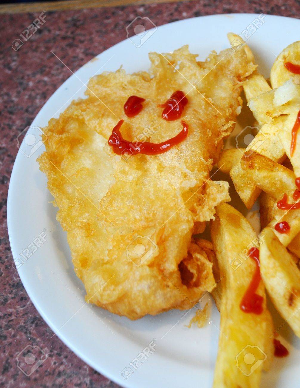 16841376-kids-meal-of-fish-and-chips-with-a-smiley-face-drawn-in-tomato-sauce.jpg