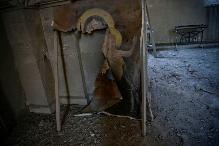 A damaged icon painting is pictured on October 13, 2020 inside the Ghazanchetsots (Holy Saviour) Cathedral in the historic city of Shusha, some 15 kilometers from the disputed Nagorno-Karabakh province's capital Stepanakert, that was hit by a bomb during the fighting between Armenia and Azerbaijan over the breakaway region.