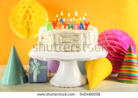 stock-photo-birthday-cake-with-candles-on-color-background-540466036.jpg