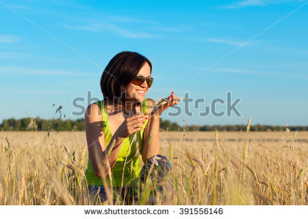 stock-photo-beautiful-happy-farmer-woman-worker-in-wheat-field-enjoying-sunset-and-smell-of-grain-391556146.jpg