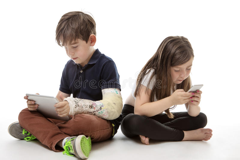 children-engrossed-technology-young-girl-boy-playing-their-tablet-computer-mobile-phone-64641308.jpg