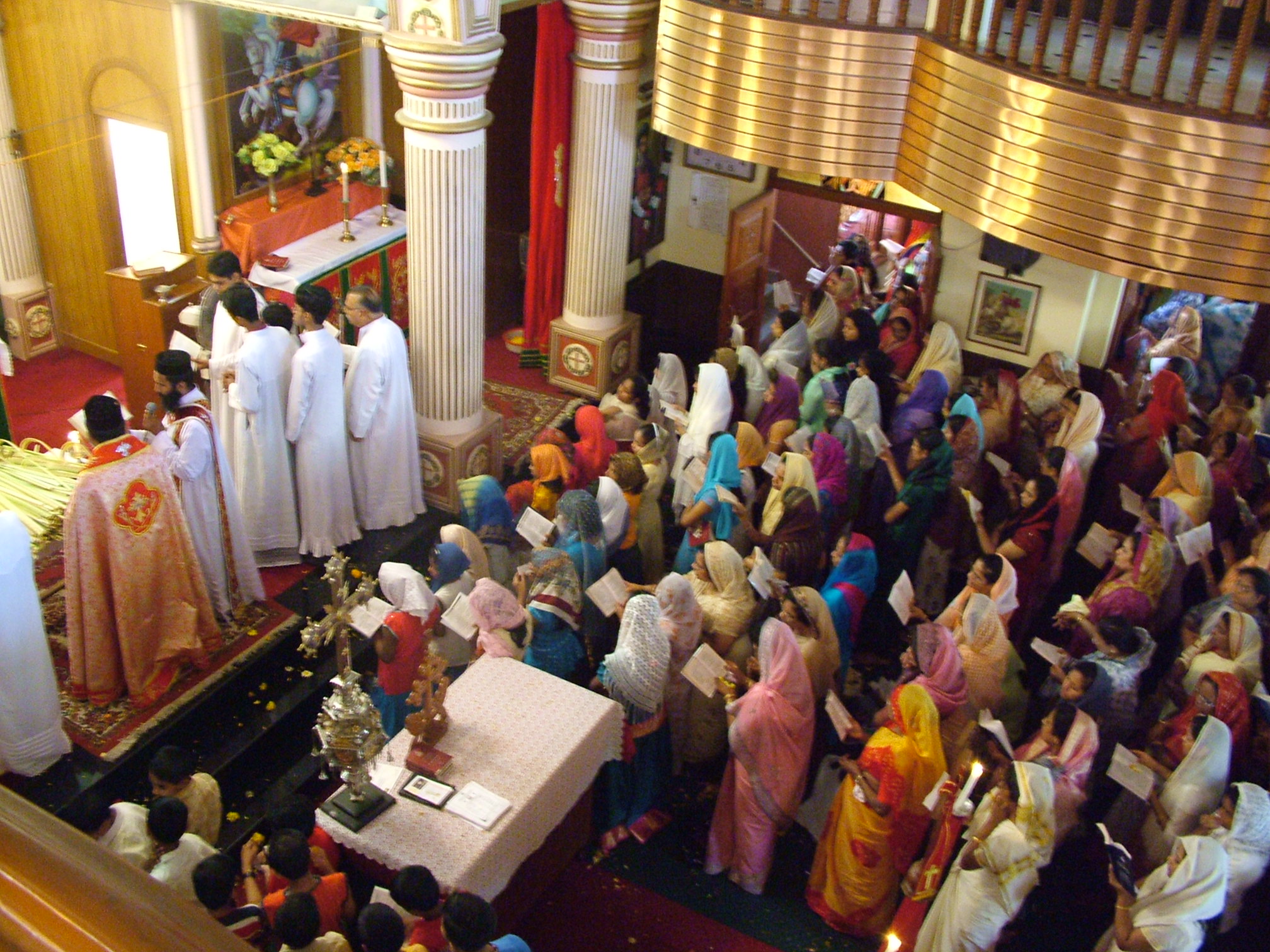 Women_in_Syrian_Orthodox_Church_Palm_Sunday_Bombay.jpg