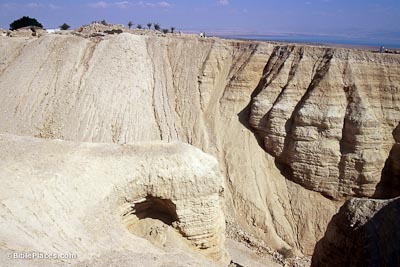 Qumran-Cave-5-with-ruins-in-background-looking-east-tbs96199802-bibleplaces.jpg