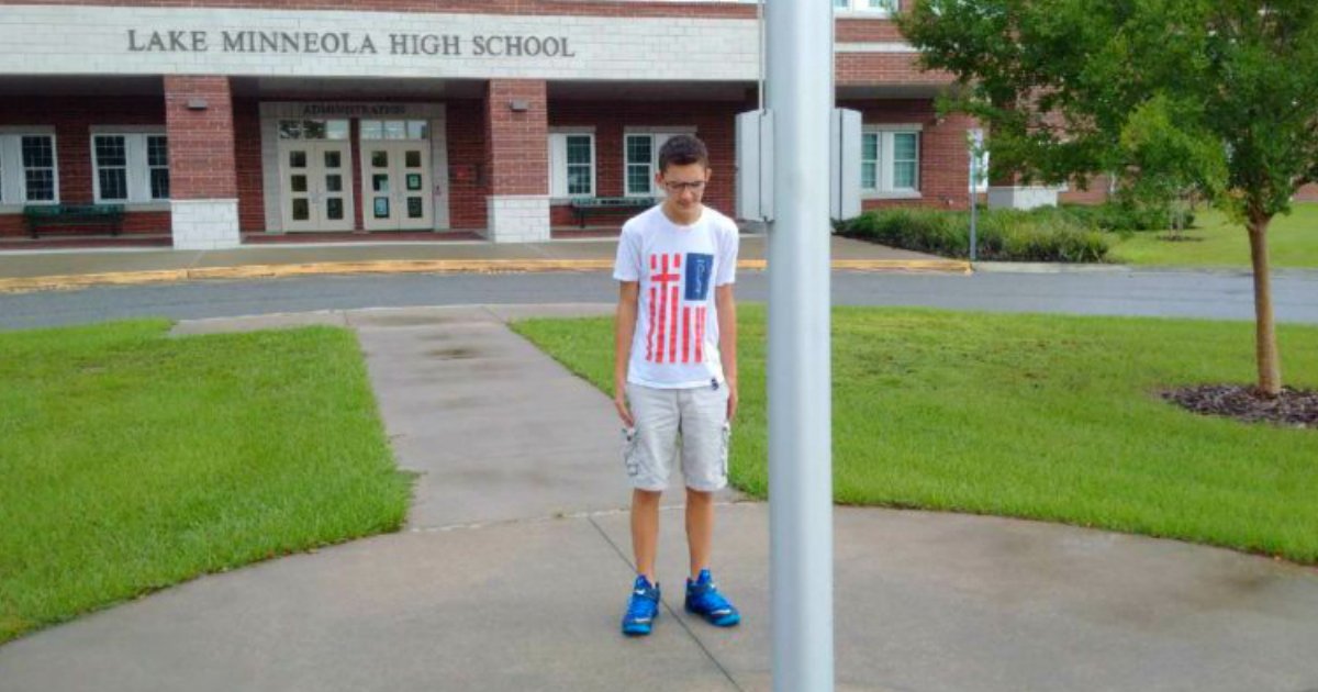 godupdates-viral-photo-of-boy-standing-alone-at-the-flag-pole-praying-fb.jpg